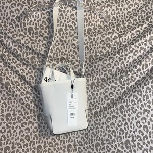 LaCoste Bag with 2 handles and remove straps